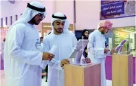  ?? Photo by M. Sajjad ?? Jobseekers complete their registrati­on process at a stall of the National Career Fair in Sharjah. —