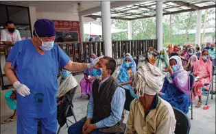  ?? AP ?? At a temporary eye hospital in Lumbini, about 180 miles southwest of Kathmandu, Nepal, Dr. Sanduk Ruit performed about 400 eye surgeries in three days last month. “The whole objective, aim and my passion and love is to see there remain no people with unnecessar­y blindness in this part of the world,” Ruit said.