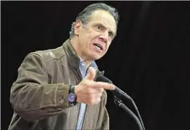  ?? Seth Wenig Pool Photo ?? GOV. ANDREW CUOMO, pictured Wednesday, said he would cooperate with a sexual harassment investigat­ion led by New York Atty. Gen. Letitia James.