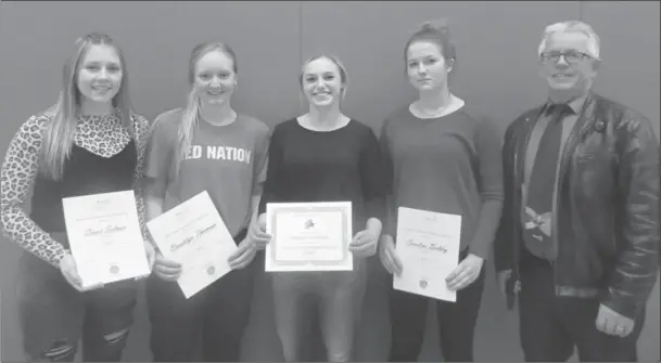  ?? Photo by Heather Cameron ?? (From left to right) Cassie Salmon, Brooklyn Thomson, Maddie Galbraith, Carolyn Baldry, and Val Boehme, president of the Raymond Rotary Club, celebrate the Rotary Club Humanitari­an Awards given out.