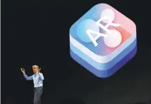  ?? GARY REYES/STAFF ?? Apple’s Craig Federighi touts the ARKit during the WWDC in San Jose on June 5. Augmented reality allows computer-generated images or videos to be layered on top of the user’s view of the real world.