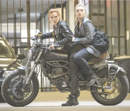  ?? MARVEL/DISNEY ?? Family drama: Scarlett Johansson, left, reprises her role in the new movie Black Widow, while Florence Pugh joins the Marvel Universe.