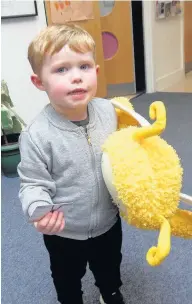  ??  ?? Joined up thinking Raploch Nursery pupil Harrison Brown-Carroll with his membership card