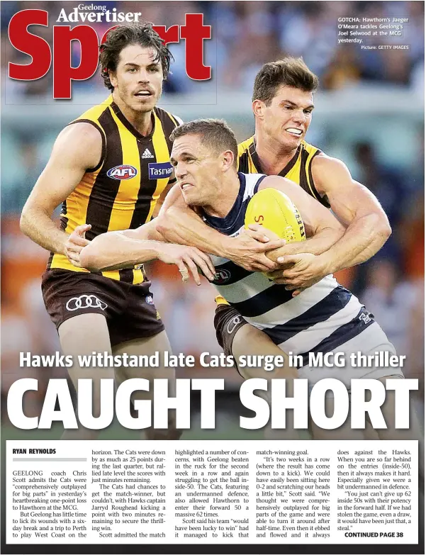  ?? Picture: GETTY IMAGES ?? GOTCHA: Hawthorn’s Jaeger O'Meara tackles Geelong’s Joel Selwood at the MCG yesterday. CONTINUED PAGE 38