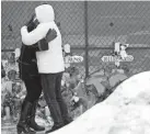  ?? JOSHUA LOTT/GETTY IMAGES ?? Prayer vigil last month in Aurora, Illinois.