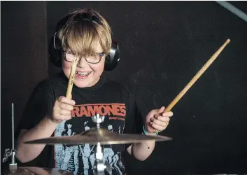  ??  ?? Marshall Brooks was rocking out so hard he broke his drumstick during rehearsal at School of Rock Regina.