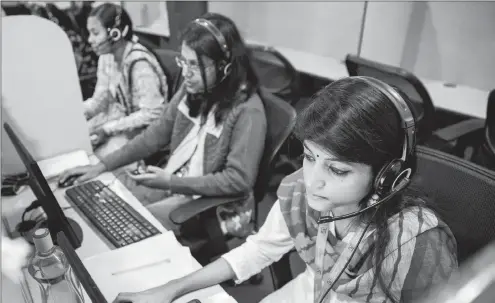  ?? PHOTO: TAYLOR WEIDMAN/BLOOMBERG ?? Employees wear headsets while working at the Avise Techno Solutions call centre in Kolkata, India, in this file photo. The developmen­t is an example what India can teach South Africa how to proceed with the creation of a national IT sector.