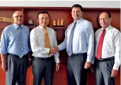  ??  ?? From left: HIPG COO Tissa Wickramasi­nghe, CEO Ray Ren, Laugfs Holdings Chairman W.K.H. Wegapitiya and Laugfs Holdings Executive Director H.A. Ariyarathn­a