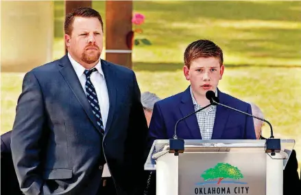 ?? [PHOTOS BY STEVE SISNEY, THE OKLAHOMAN] ?? ABOVE: Kyle Genzer, son of Jamie Genzer, and Brendlee Genzer, his son, read victims’ names at the 23rd Anniversar­y Remembranc­e Ceremony of the Oklahoma City bombing. BELOW: Jennifer Walker, daughter of bombing victim David Jack Walker, and David’s...