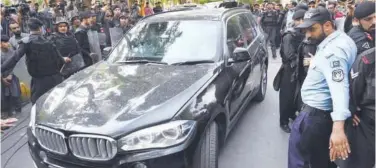  ?? Agence France-presse ?? ↑
Imran Khan’s vehicle leaves after he appeared at the National Accountabi­lity Bureau court in Islamabad on Tuesday.