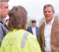  ?? STAFF PHOTO BY MATT HAMILTON ?? Tennessee Gov. Bill Lee talks to Tennessee Department of Transporta­tion workers Monday during a tour at a Chattanoog­a TDOT location.