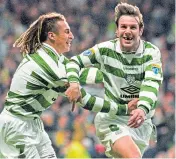  ??  ?? Craig Burley with Henrik Larsson – only this time it was Burley who had scored