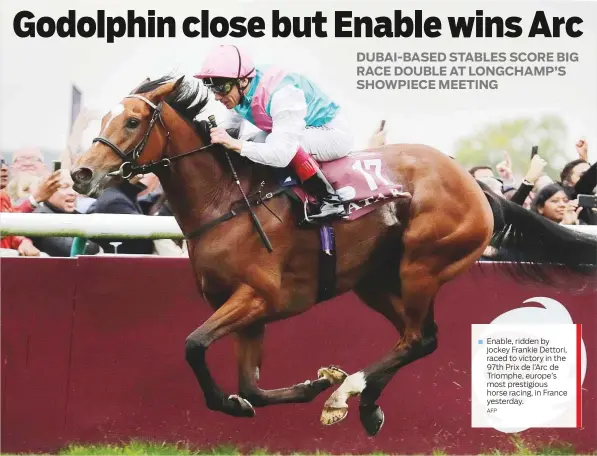  ?? AFP ?? Enable, ridden by jockey Frankie Dettori, raced to victory in the 97th Prix de l’Arc de Triomphe, europe’s most prestigiou­s horse racing, in France yesterday.