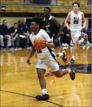  ?? AUSTIN HERTZOG - MEDIANEWS GROUP ?? Hill School point guard Jacob Meachem dribbles in transition against Cristo Rey during a PAISAA first round game on Feb. 17 at Hill School.
