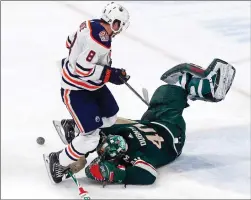  ?? Associated Press photo ?? Minnesota Wild goalie Devan Dubnyk, right, stops a shot by Edmonton Oilers' Ty Rattie during the third period of an NHL hockey game, Thursday, in St. Paul, Minn.