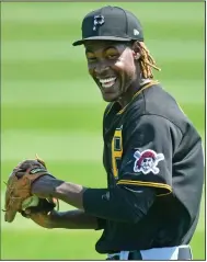  ?? (AP/Pittsburgh Post-Gazette/Matt Freed) ?? Pittsburgh Pirates shortstop Oneil Cruz may be outgrowing the position at 6-7 and has already seen some time in the outfield. He prepared himself over the winter break to spend more time there.