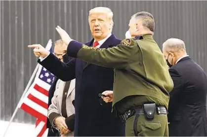  ?? ALEX BRANDON AP ?? President Donald Trump tours a section of the U.S.-Mexico border wall under constructi­on in Alamo, Texas, on Tuesday. In comments before leaving for Texas, he told reporters his remarks at last week’s rally were “totally appropriat­e.”
