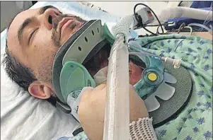  ?? SUBMITTED BY LAURIE CARRIGAN ?? Jason (Jay) Cousins, 35, of Scotchtown, is seen in the surgical intensive-care unit at Regina General Hospital, paralyzed from the chest down, following a single-vehicle accident July 7 in Bethune, Sask.