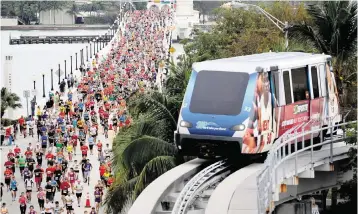  ?? CARL JUSTE Miami Herald file ?? Runners make their way east over the Venetian Causeway near the Arsht Metromover Station during the ING Marathon on Jan. 29, 2012.