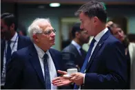  ?? Associated Press ?? ■ Britain's Foreign Secretary Jeremy Hunt, right, talks to his Spanish counterpar­t Josep Borrell on Monday during a European Foreign Affairs meeting at the European Council headquarte­rs in Brussels. European Union nations were looking to deescalate tensions in the Persian Gulf area and call on Iran to stick to the 2015 nuclear deal, despite the pullout of the United States from the accord and the re-imposition of U.S. sanctions on Tehran.