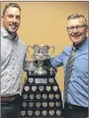  ?? FACEBOOK ?? Brett and Peter Gallant pose with the Brier Tankard after Brett helped Team Gushue win the 2017 Canadian men’s curling championsh­ip.