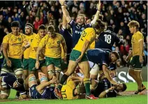  ??  ?? Triumph: Scotland celebrate at the final whistle following their 29-point destructio­n of Australia in last year’s test