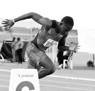  ?? ?? Racers Track Club’s Oblique Seville tackles a 400-metre at the Camperdown Classic inside the National Stadium yesterday.