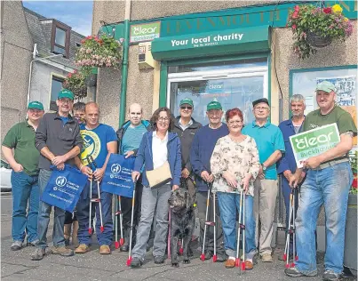  ?? Picture: Steven Brown ?? TAKING CONTROL: Members of the CLEAR Buckhaven team, pictured outside the office on College Street, have taken it upon themselves to rid the streets of rubbish by collecting litter dropped by individual­s in an effort to keep the area tidy.