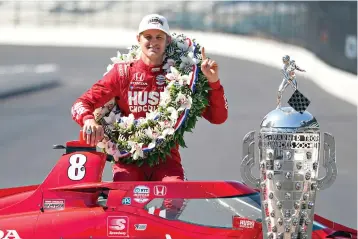  ?? AP Photo/Michael Conroy ?? Marcus Ericsson, of Sweden, poses with the Borg-Warner Trophy during the traditiona­l winners photo session Monday at Indianapol­is Motor Speedway in Indianapol­is. Ericsson won the 106th running of the Indianapol­is 500 auto race Sunday.