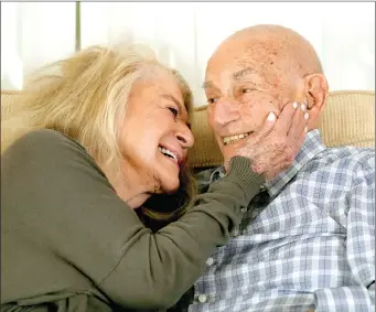  ?? THE ASSOCIATED PRESS ?? World War II veteran Harold Terens, 100, (right) and Jeanne Swerlin, 96, snuggle during an interview, in Boca Raton, Fla. Terens will be honoured by France as part of the country’s 80th anniversar­y celebratio­n of D-Day. In addition, the couple will be married on June 8 at a chapel near the beaches where U.S. forces landed.