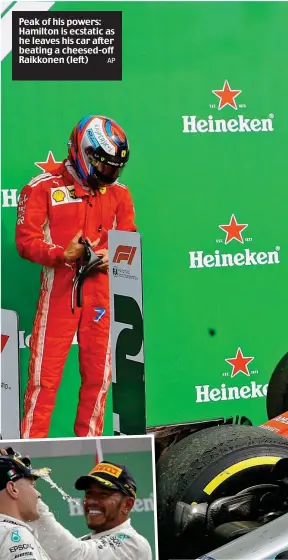  ?? AP ?? Peak of his powers: Hamilton is ecstatic as he leaves his car after beating a cheesed-off Raikkonen (left)