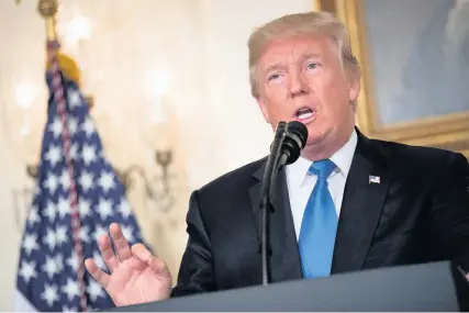  ?? Drew Angerer ?? > President Donald Trump making his statement in the White House on the US administra­tion’s strategy for dealing with Iran