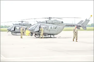  ??  ?? Texas National Guard helicopter­s travelling to the Texas-Mexico border prepare to fly in Austin.