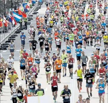  ?? CHARLES KRUPA / AP ?? The 2021 Boston Marathon has been scheduled for Oct. 11 and awaits approval by the state.