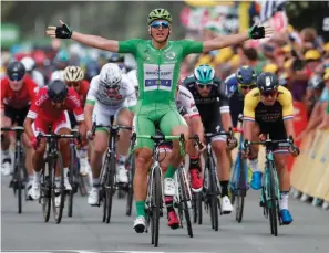  ?? (Reuters) ?? STEP FLOORS RIDER Marcel Kittel of Germany celebrates as he nears the finish line ahead of the pack to capture yesterday’s 178-kilometer Stage 10 of the Tour de France from Perigueux to Bergerac.