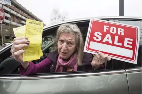  ?? BERNARD WEIL/TORONTO STAR ?? Barbara Bell received two tickets after putting a "for sale" sign in her car, though bylaws allow those with parking permits to advertise vehicles for sale.