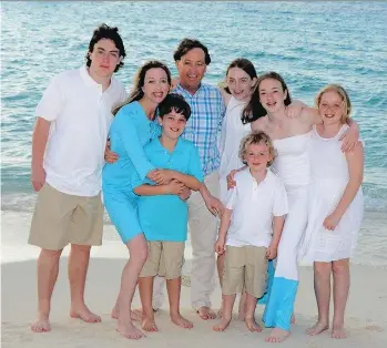  ??  ?? Julie Cole, second from left, is seen with her family. The co-founder of Mabel’s Labels Inc. says she does her best to minimize business travel and occasional­ly takes a child with her on the road. Cole keeps in touch via FaceTime and texts with her...