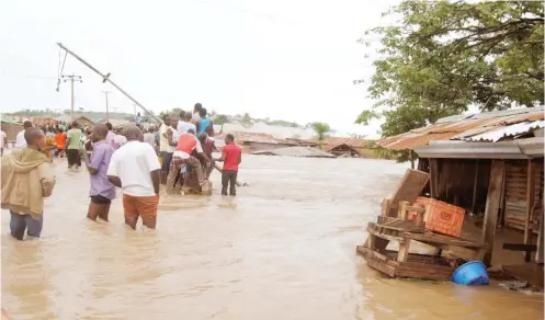  ??  ?? A flooded neighbourh­ood in Suleja after a heavy downpour yesterday Photo: