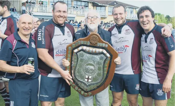  ??  ?? From left, coach Simon Smith, skipper Matty Jones, reporter Dave Campbell, Tom Ratcliffe and Tom Harrison celebrate winning the Yorkshire Shield Pictures by Andy Standing