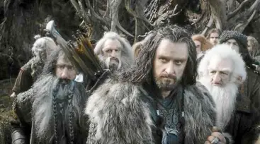  ??  ?? Thorin Oakenshiel­d (richard armitage, foreground) leads his men into the mountains in a bid to reclaim their homeland.