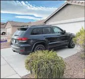  ?? David Wilson Las Vegas Review-journal ?? The SUV that police say fled the scene of a crash is parked in the driveway of Gary Hargis’ home in November 2022.