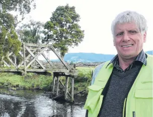  ?? PHOTO: RICHARD DAVISON ?? Building bridges . . . Tahakopa historian Don Sinclair says negotiatio­ns to build a track to a Catlins heritage bridge designed by medical pioneer Sir Truby King are making progress, thanks to compromise­s made by local landowners this week.