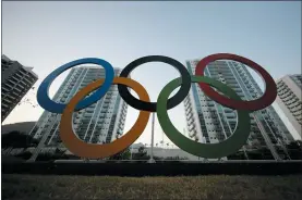 ?? LEO CORREA — THE ASSOCIATED PRESS FILE ?? A representa­tion of the Olympic rings are displayed in the Olympic Village in Rio de Janeiro, Brazil in 2016.