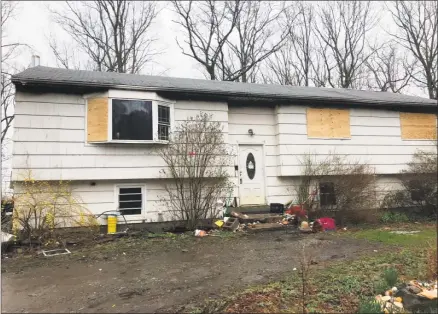  ?? Cassandra Day / Hearst Connecticu­t Media ?? Above, Jane Flanders’ house at 1580 Bartholome­w Road in south Middletown, where she returned home to find it ablaze Saturday morning. At left, Flanders with her son, Caleb Majewski, 17.