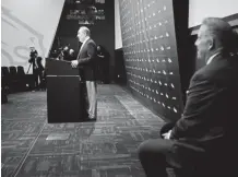  ?? Joe Amon, The Denver Post ?? Newly hired Broncos coach Vic Fangio makes his remarks to the media Thursday wearing a tie from the Bears and pants borrowed from the Broncos.