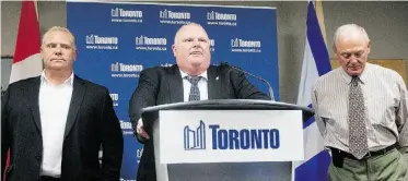  ?? Michelle Siu/ THE CANADIAN PRESS ?? Toronto Mayor Rob Ford, flanked by his brother Doug, left, a city councillor, and Deputy Mayor Doug Holyday, addresses media at Toronto City Hall Friday. Ford denied smoking crack cocaine.