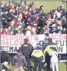  ?? ARNOLD GOLD/AP ?? Demonstrat­ors stage a protest at the Yale Bowl, delaying the start of the second half of the Yale-Harvard football game Saturday in New Haven.