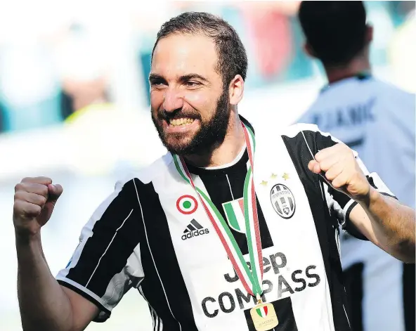  ?? — GETTY IMAGES FILES ?? Juventus striker Gonzalo Higuain, shown celebratin­g after his club officially clinched Italy’s Serie A championsh­ip last month, has been brilliant this season heading into Saturday’s Champions League final.