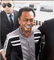  ??  ?? Remanded: Yusof being led to the magistrate’s court in Kota Kinabalu.