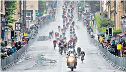  ??  ?? Dirty race A muddy Chris Lawless pulled out of the Men’s Road Race on Day 11 of the European Championsh­ips in Glasgow yesterday. Rain drenched him and other cyclists. The Met Office has issued storm warnings for the North and North East of the UK.